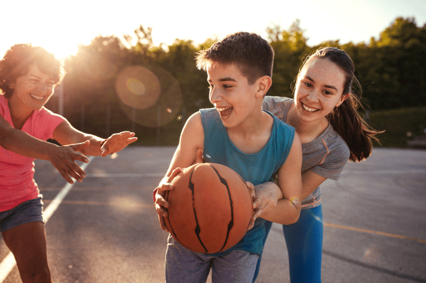 Family playing basketball